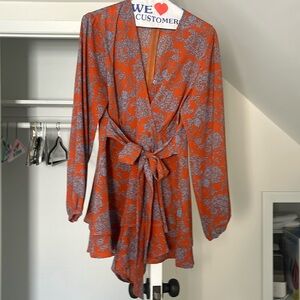 Orange and blue floral long sleeve romper